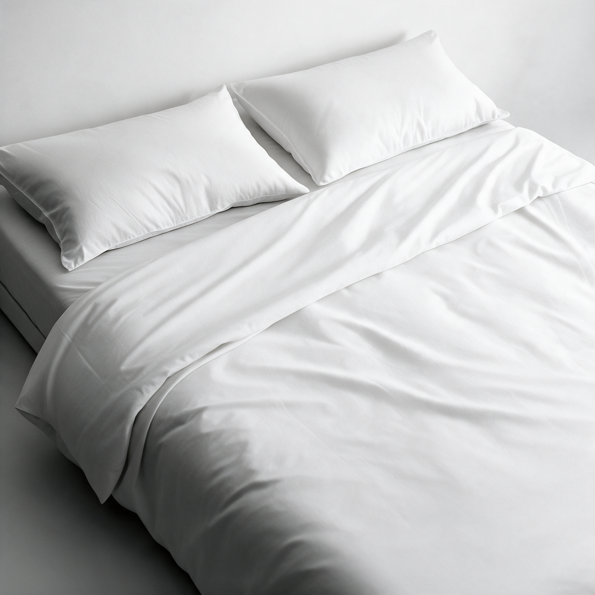 Letto con copripiumino, coprimaterasso e copricuscini antiacaro Acarbasic® bianchi